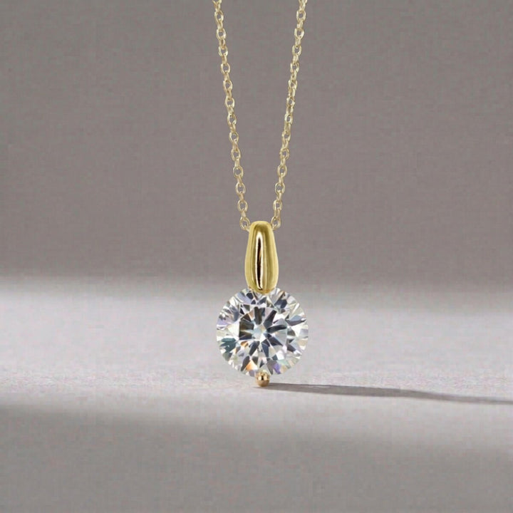 The Brilliant CZ Solitaire Pendant in gold, close up